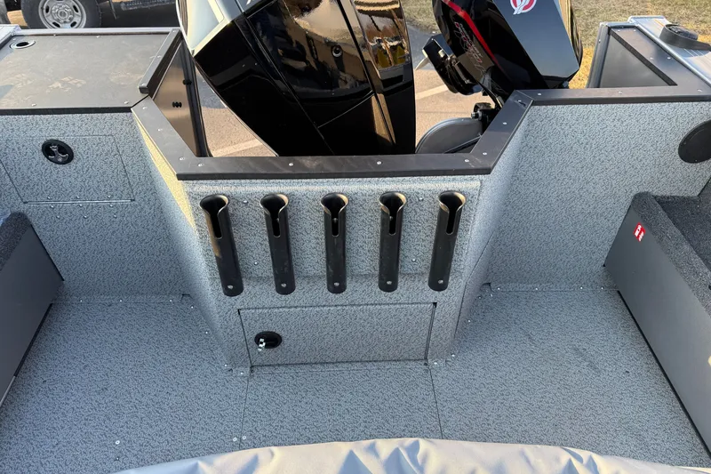 Slide: The Image of 2026 Crestliner 2050 Commander boat interior with rod holders and motor. - 12