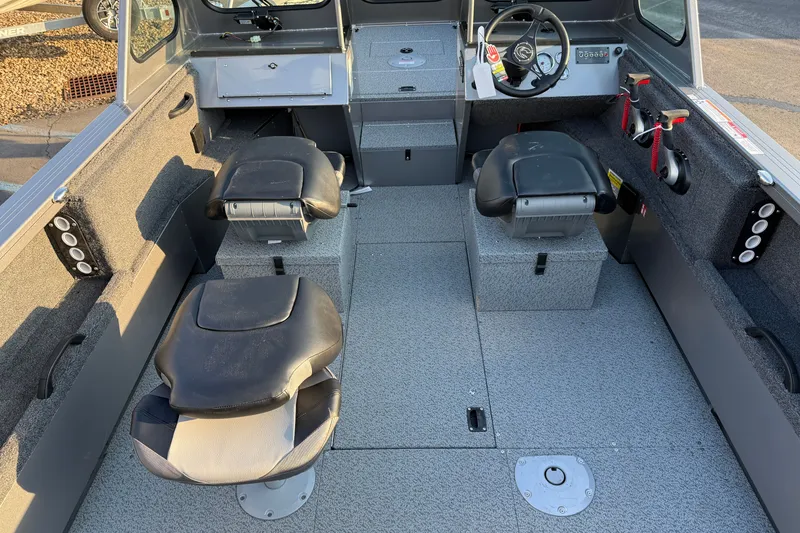 Slide: The Image of Interior of 2026 Crestliner 2050 Commander boat with seating and steering console. - 11
