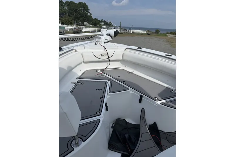 Slide: The Image of 2017 Sea Hunt Ultra 211 boat interior with seating and storage compartments. - 3