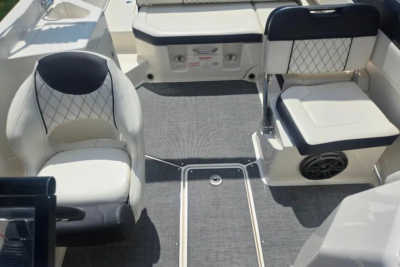 Slide: The Image of Interior of a 2020 Bayliner DX 2250 boat with stylish seating and modern design. - 22