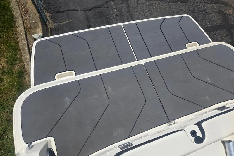 Slide: The Image of Bayliner DX 2250 2020 boat deck with sleek gray panels and white trim. - 26