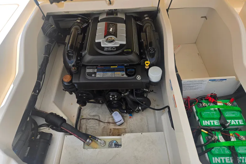 Slide: The Image of 2020 Bayliner DX 2250 engine compartment with Mercury 250 engine and Interstate batteries. - 24