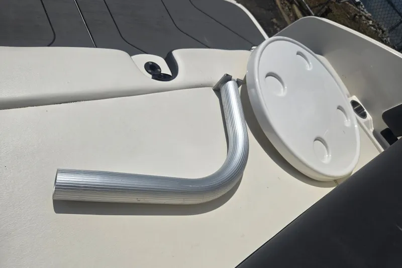 Slide: The Image of Bayliner DX 2250 boat deck with metal handle and circular hatch, 2020 model. - 25