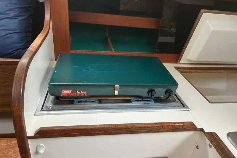 Slide: The Image of Vintage Coleman two-burner propane stove on a 1976 Pearson 10M sailboat galley. - 24