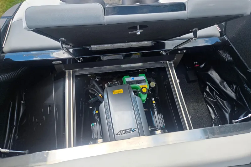 Slide: The Image of Open engine compartment of 2025 Centurion Nv233 boat, showcasing powerful 409 HP engine. - 17