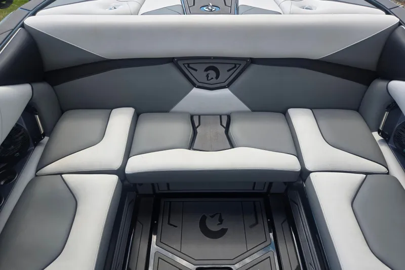 Slide: The Image of Luxurious seating in 2025 Centurion Nv233 boat, featuring sleek gray upholstery and modern design. - 14