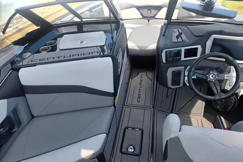 Slide: The Image of Interior of 2025 Centurion Nv233 boat, featuring sleek design and modern controls. - 25