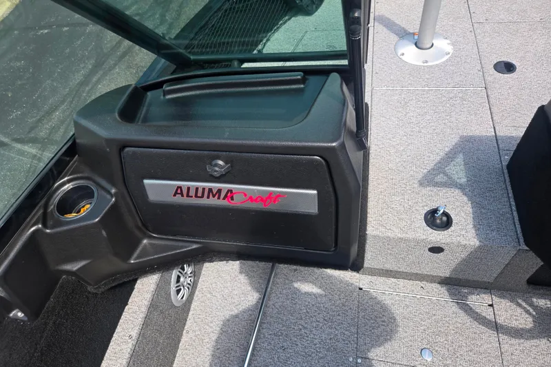 Slide: The Image of 2023 Alumacraft Competitor 165 Sport interior with logo and carpeted flooring. - 14