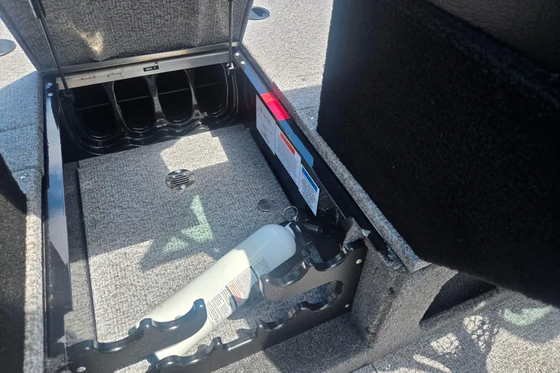 Slide: The Image of Storage compartment in 2023 Alumacraft Competitor 165 Sport boat, featuring organized interior space. - 15