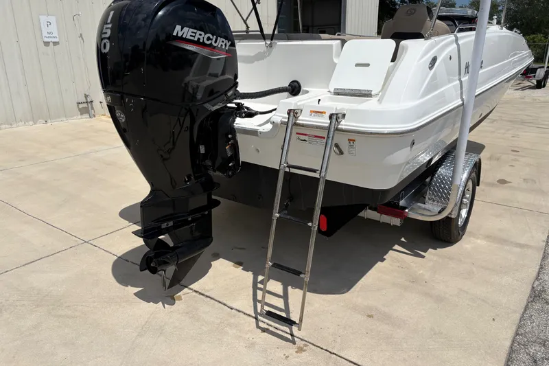 Slide: The Image of 2022 Hurricane SunDeck Sport 201 OB boat with Mercury outboard motor and trailer. - 9