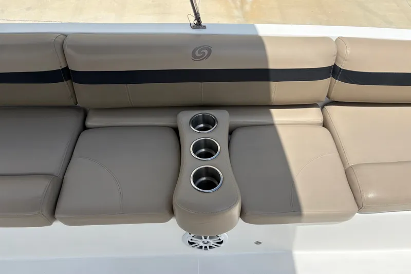 Slide: The Image of 2022 Hurricane SunDeck Sport 201 OB boat seating with cup holders, beige upholstery. - 24