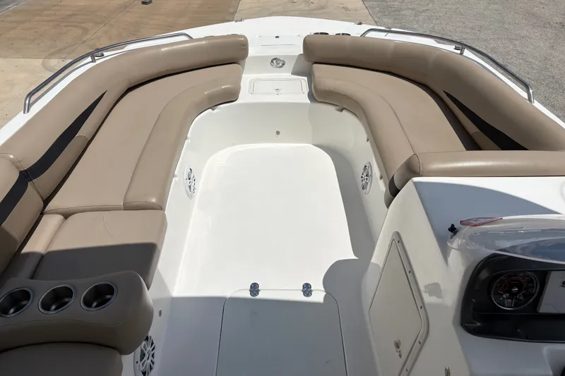 Slide: The Image of Interior view of 2022 Hurricane SunDeck Sport 201 OB boat with beige seating. - 19