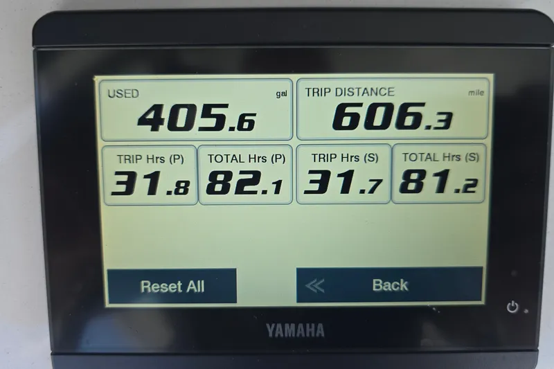 Slide: The Image of Display screen showing fuel usage and trip data for 2023 Sea Hunt Ultra 275SE boat. - 27