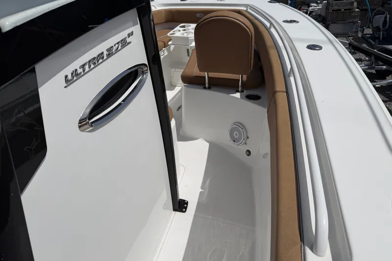 Slide: The Image of 2023 Sea Hunt Ultra 275SE boat interior with seating and speaker detail. - 18