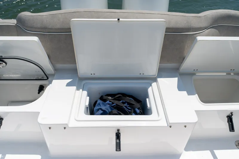 Slide: The Image of Open storage compartments on a 2024 Sea Hunt Ultra 265SE boat. - 35