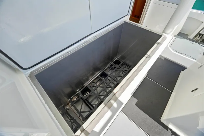 Slide: The Image of Open storage compartment on 2018 Dixon 55 boat, showcasing spacious interior design. - 59