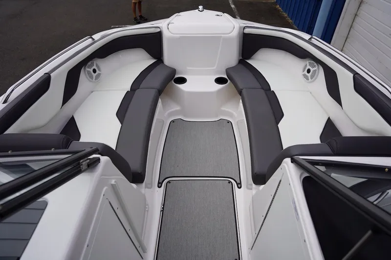 Slide: The Image of 2022 Yamaha Boats AR210 interior with sleek seating and modern design. - 5