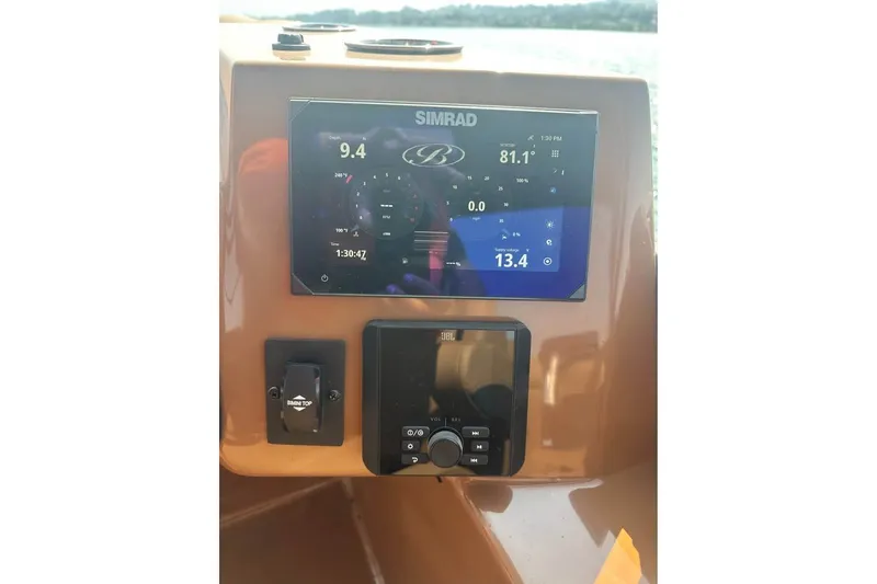 Slide: The Image of Dashboard of 2026 Bentley Pontoons Legacy 243 Navigator with Simrad display and controls. - 4