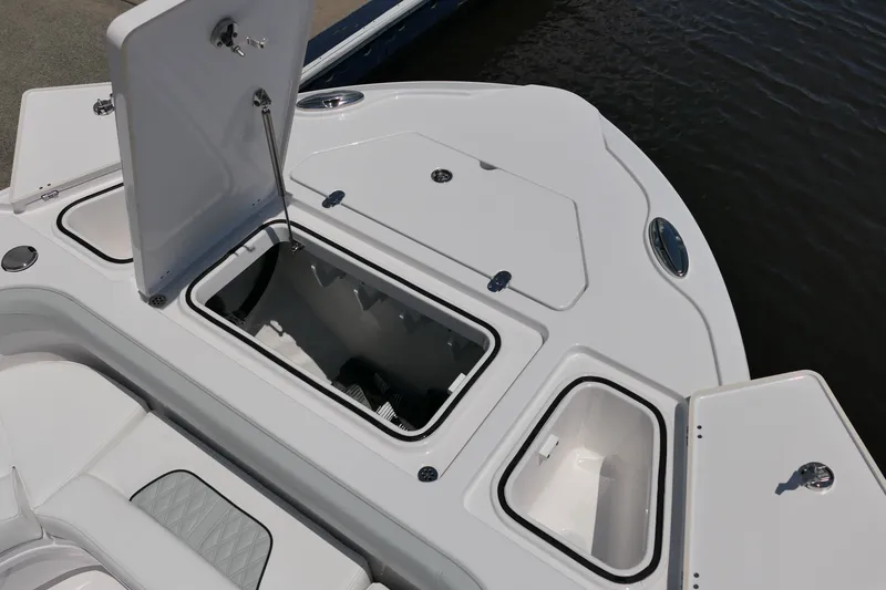 Slide: The Image of Open storage compartments on a 2027 Blackfin 262 HB boat, showcasing sleek design and functionality. - 26