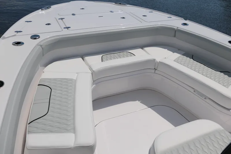 Slide: The Image of Luxurious seating area on 2027 Blackfin 262 HB boat, featuring elegant white and gray upholstery. - 19