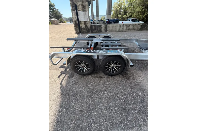 Slide: The Image of Trailer for 2027 Blackfin 262 HB boat, parked on asphalt. - 37