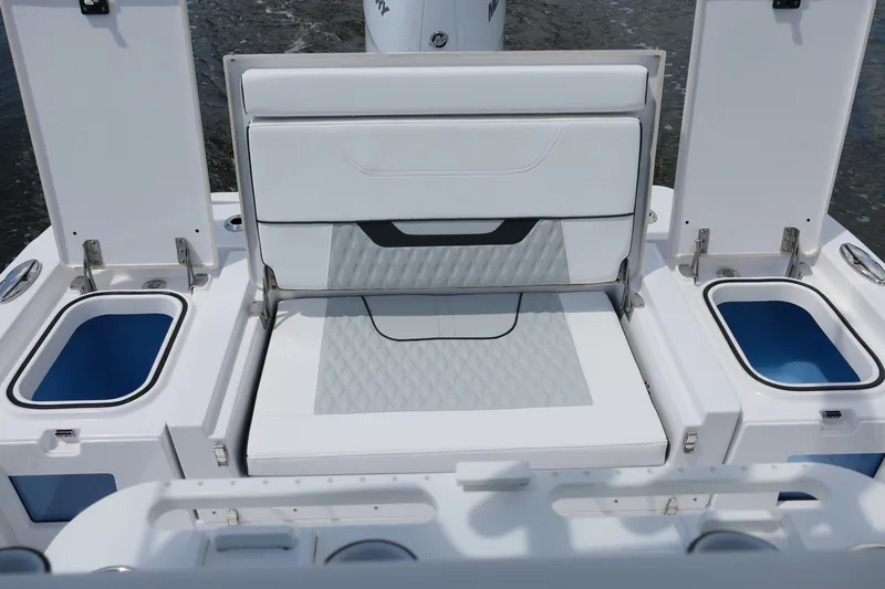 Slide: The Image of 2027 Blackfin 262 HB boat interior with cushioned seating and storage compartments. - 24