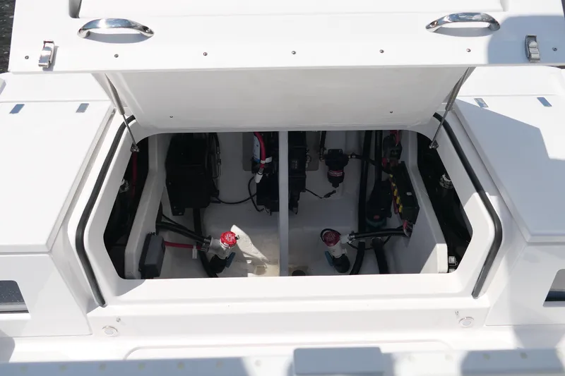 Slide: The Image of Open hatch of 2027 Blackfin 262 HB boat showing internal components and wiring. - 29
