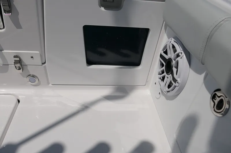 Slide: The Image of Interior of 2027 Blackfin 262 HB boat featuring speaker and storage compartment. - 30