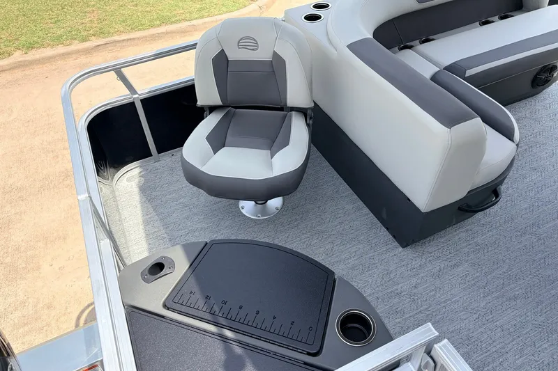 Slide: The Image of 2027 Sun Tracker Bass Buggy 18 DLX boat interior with seating and fishing station. - 30
