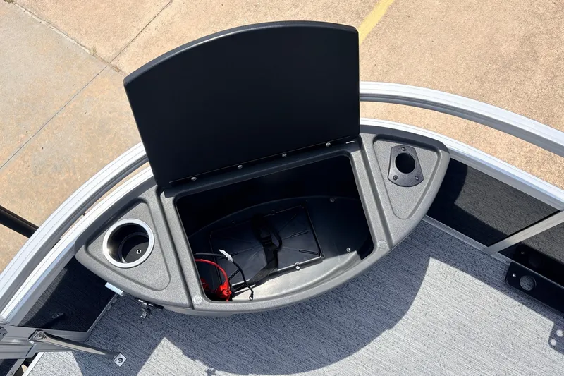 Slide: The Image of 2027 Sun Tracker Bass Buggy 18 DLX storage compartment with cup holders and wiring. - 17