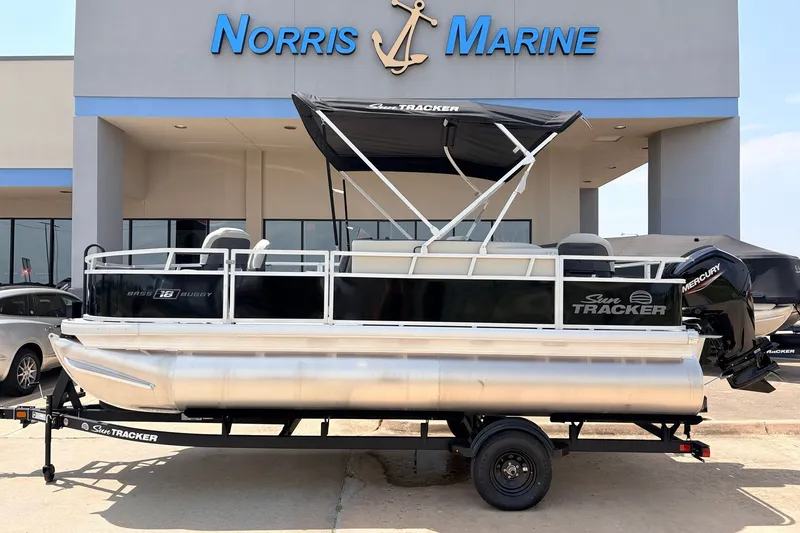 The Image of 2027 Sun Tracker Bass Buggy 18 DLX pontoon boat displayed at Norris Marine dealership. - 1
