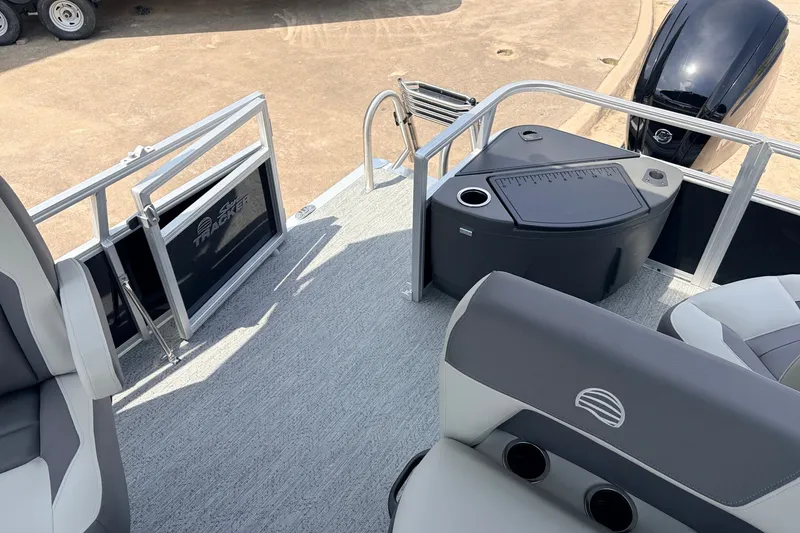Slide: The Image of 2027 Sun Tracker Bass Buggy 18 DLX pontoon boat interior with seating and storage. - 34
