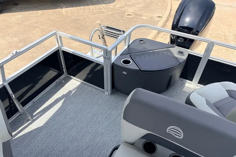 Slide: The Image of 2027 Sun Tracker Bass Buggy 18 DLX pontoon boat interior with seating and storage. - 33