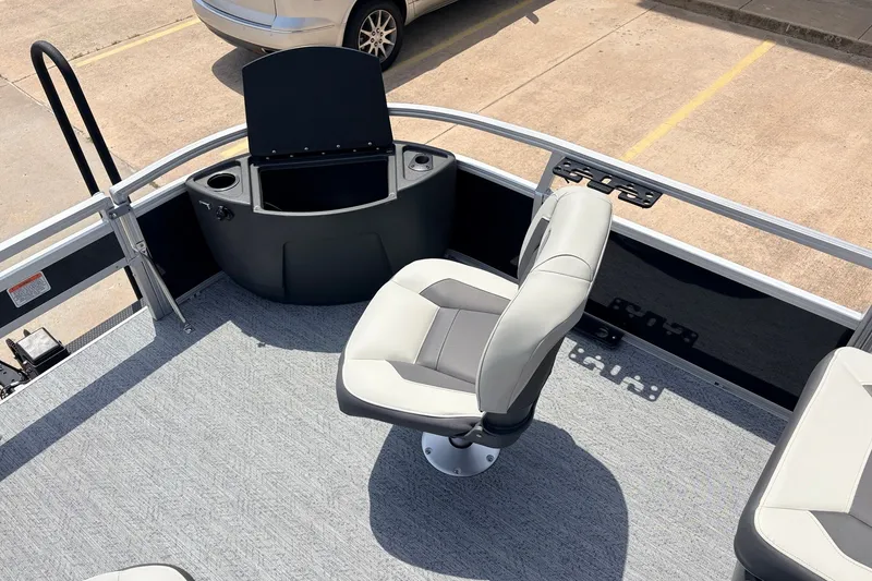 Slide: The Image of 2027 Sun Tracker Bass Buggy 18 DLX boat interior with seating and storage. - 16