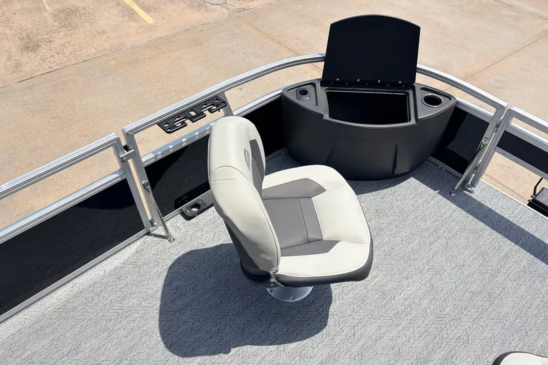 Slide: The Image of Sun Tracker Bass Buggy 18 DLX 2027 boat interior with swivel seat and storage compartment. - 14