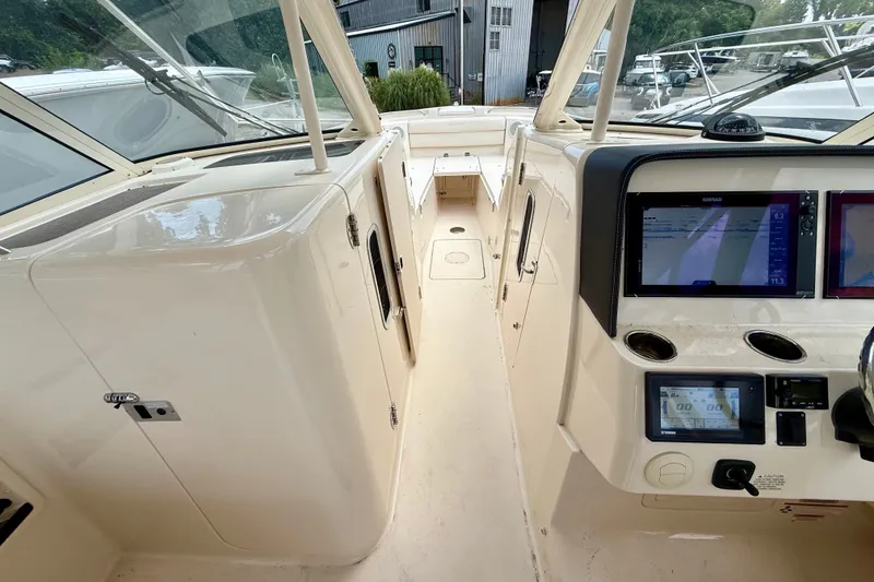 Slide: The Image of 2018 Grady-White Freedom 325 boat interior with navigation screens and control panel. - 15
