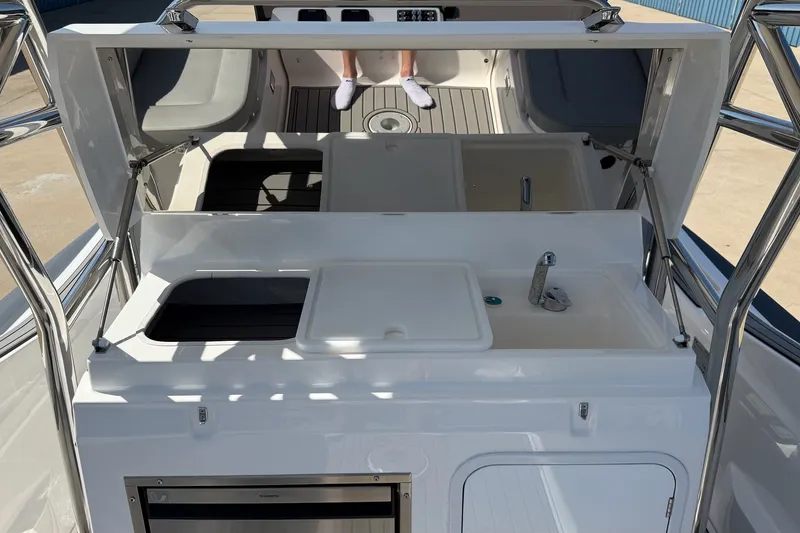 Slide: The Image of 2025 Zar Formenti 85 SL boat interior with kitchenette and seating area. - 13