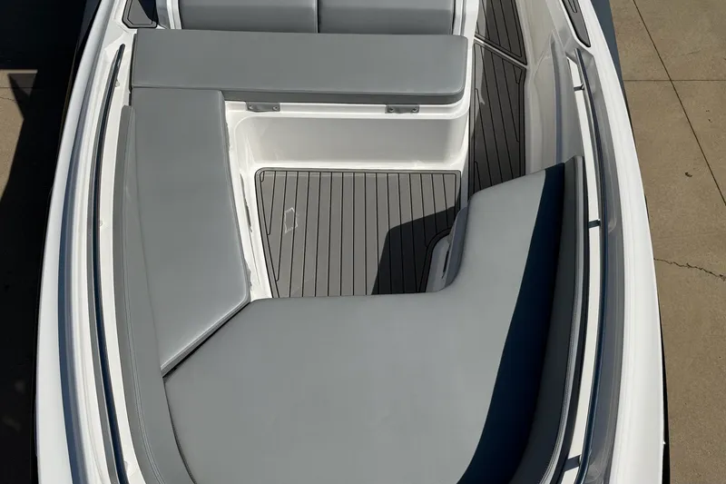 Slide: The Image of 2025 Zar Formenti 85 SL boat interior with gray cushioned seating and sleek design. - 17