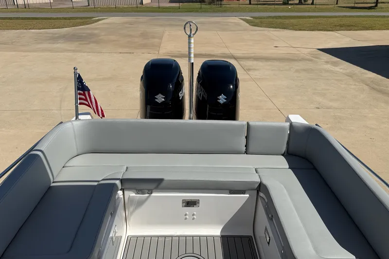 Slide: The Image of 2025 Zar Formenti 85 SL boat with dual Suzuki engines and American flag. - 15