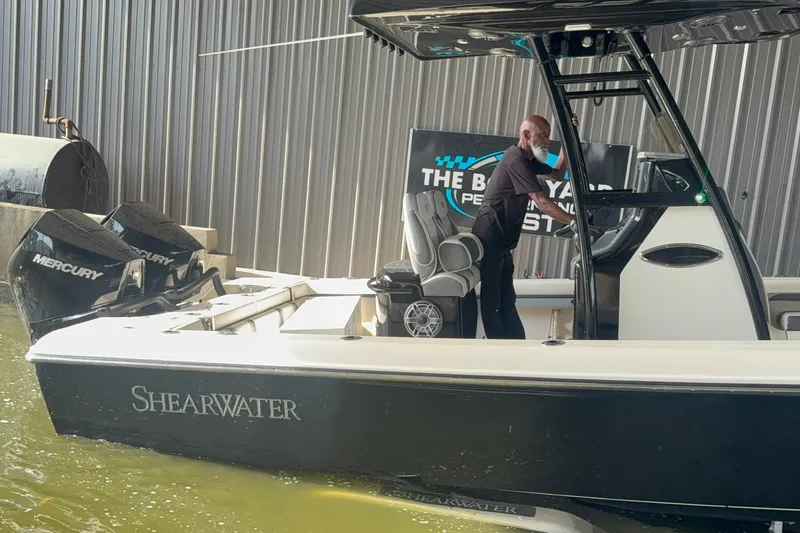 Slide: The Image of 2020 ShearWater 270 Carolina Flare boat with Mercury engines docked at marina. - 14