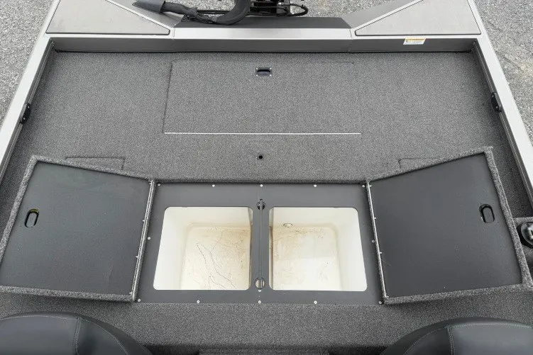 Slide: The Image of 2021 Crestliner MX 21 boat deck with open storage compartments. - 13