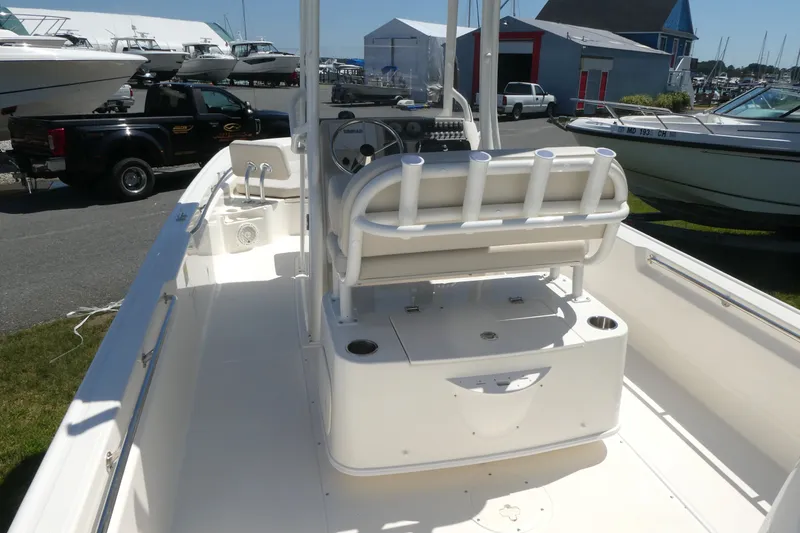 Slide: The Image of 2027 Boston Whaler 210 Montauk boat interior with seating and steering console. - 6