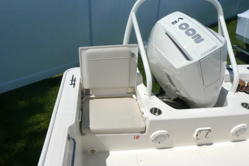 Slide: The Image of 2027 Boston Whaler 210 Montauk boat with Mercury V6 engine and seating area. - 5