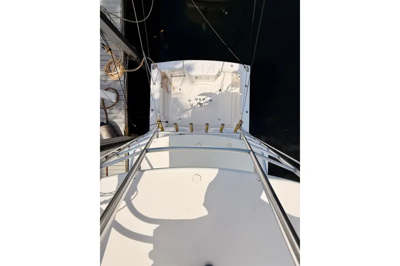 Slide: The Image of Overhead view of 2004 Cabo 35 Express boat docked at marina. - 43