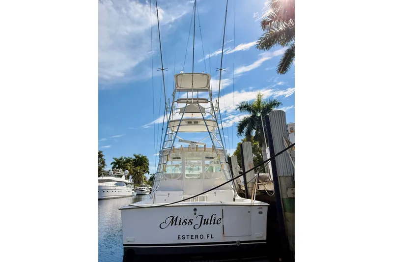 Slide: The Image of 2004 Cabo 35 Express boat docked under clear blue sky in Estero, FL. - 4