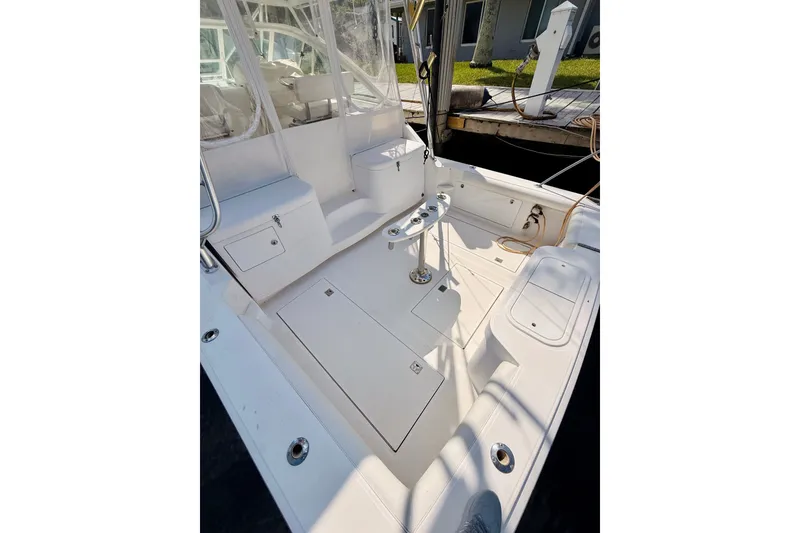 Slide: The Image of 2004 Cabo 35 Express boat cockpit with seating and storage compartments. - 6