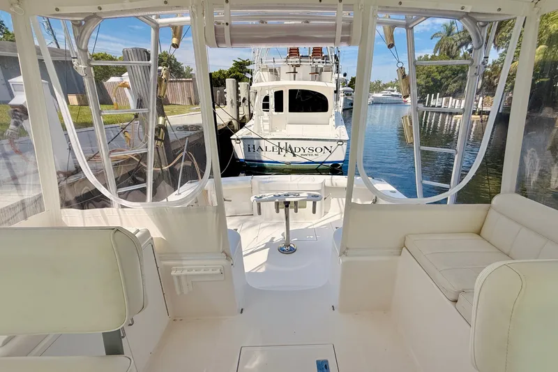 Slide: The Image of Interior view of a 2004 Cabo 35 Express boat docked at a marina. - 11
