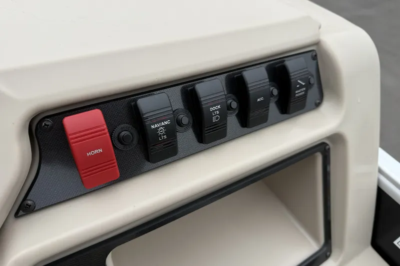 Slide: The Image of Control panel of 2027 Godfrey Xperience 2086 CX boat with switches for horn and lights. - 13