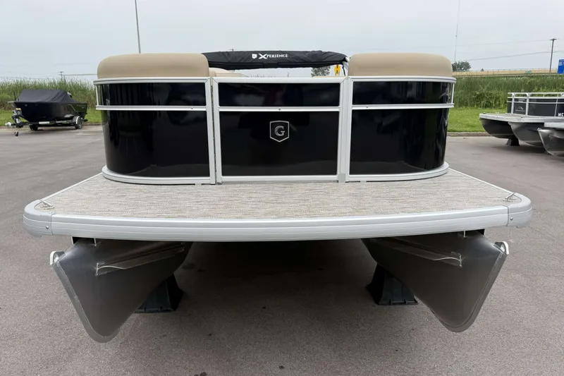 The Image of 2027 Godfrey Xperience 2086 CX pontoon boat, front view, parked on pavement. - 0