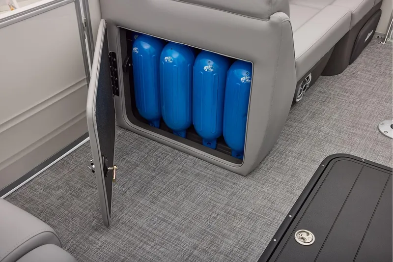 Slide: The Image of Manufacturer Provided Image: 2026 Sun Tracker Party Barge 22 XP3 storage compartment with blue fenders. - 66